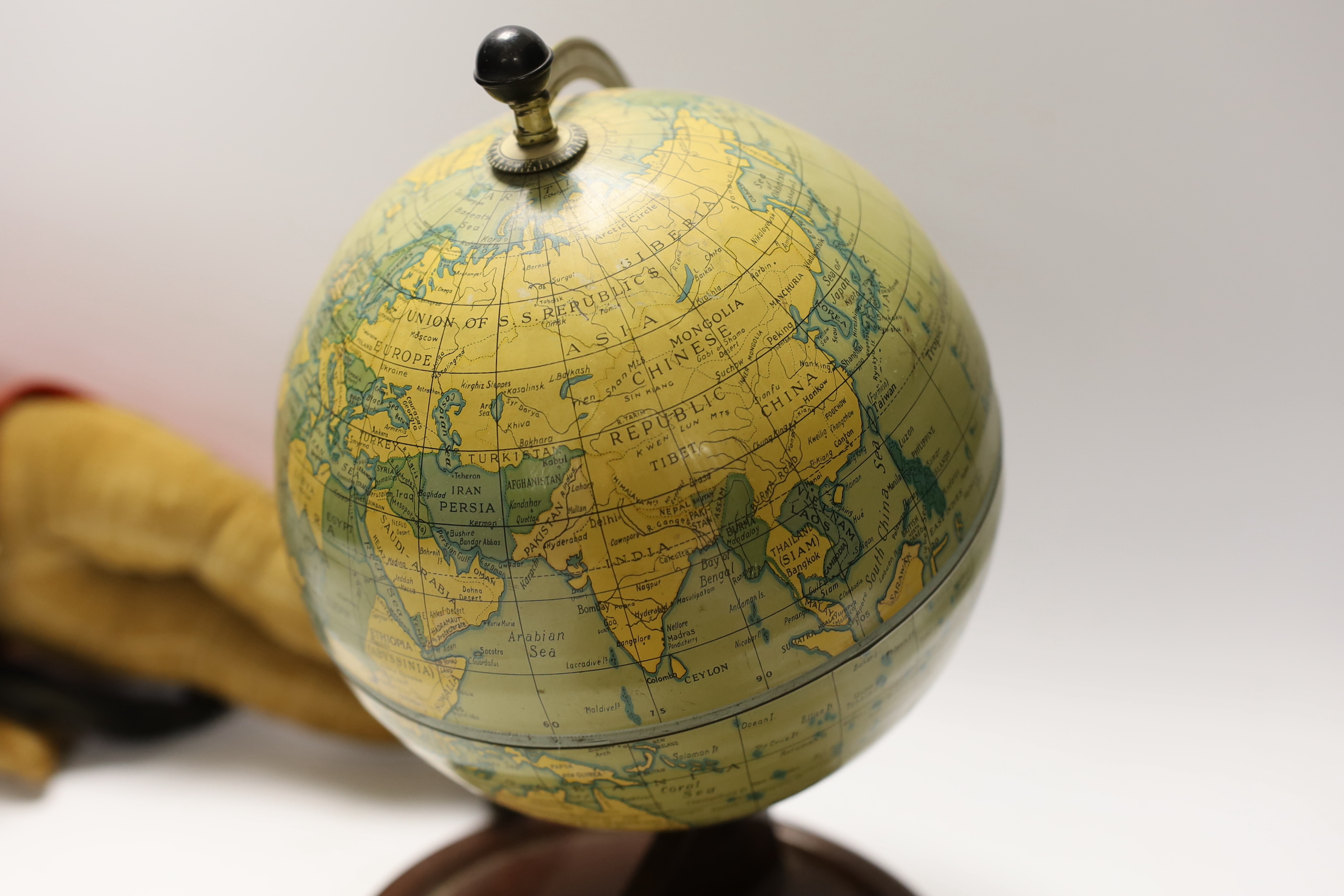 Tinplate globe and two soft toys